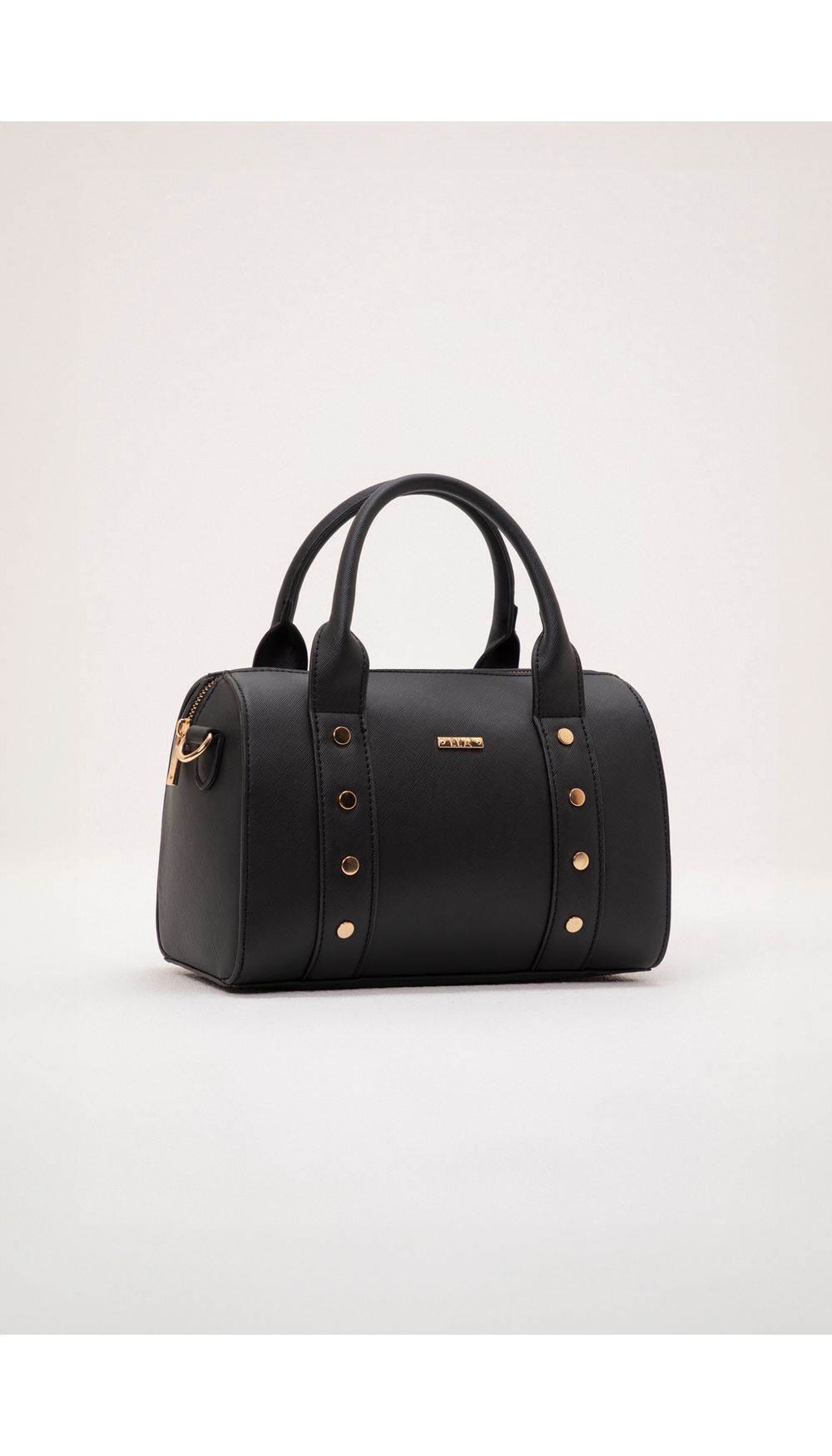 Bolso de mano taches y herraje