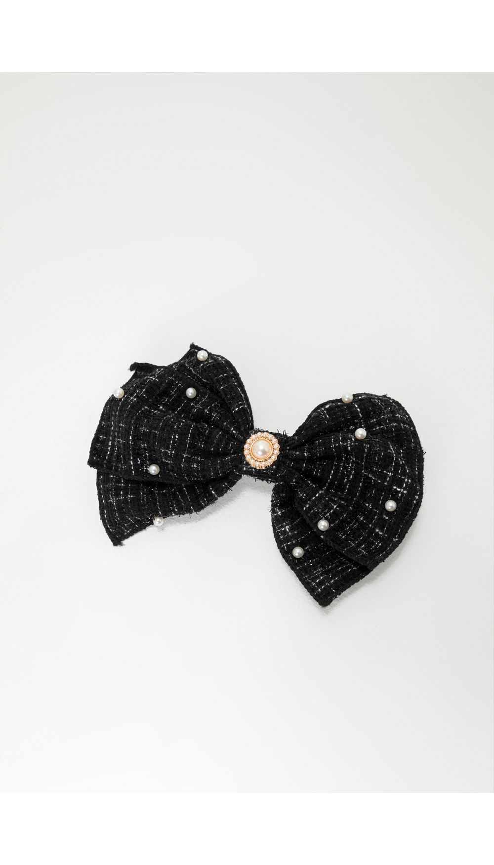 Accesorio pelo en forma de moño y perlas