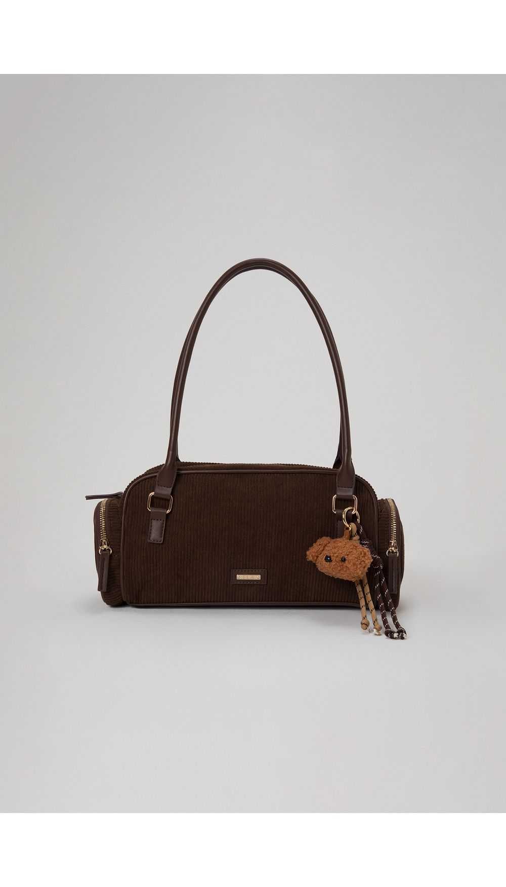 Bolso en corduroy con charm