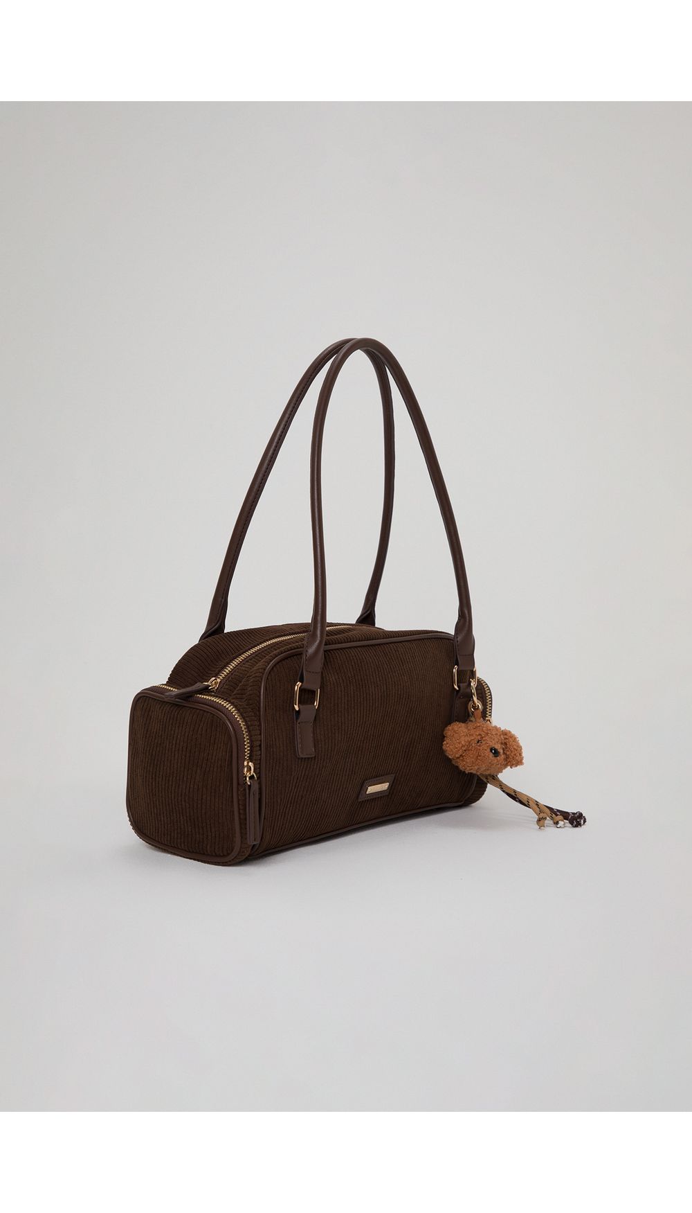 Bolso en corduroy con charm